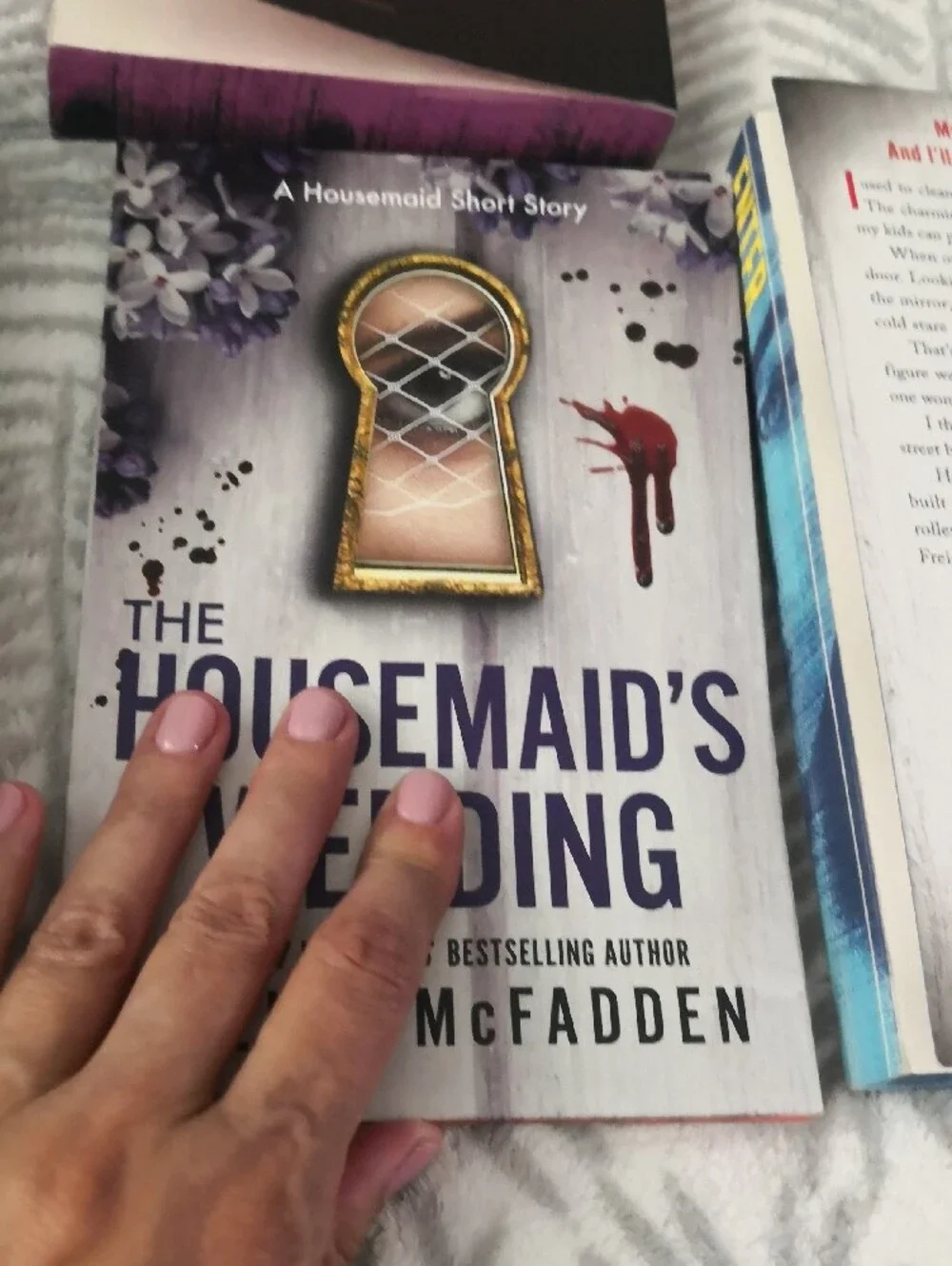 Designed edges that spell ENTER THE TWISTED WORLD OF THE HOUSEMAID when the book